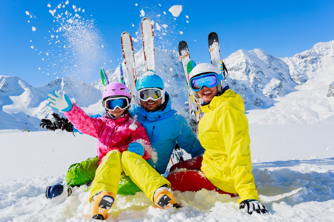 Family enjoying winter ski vacation